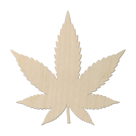 a wooden cutout of a marijuana leaf