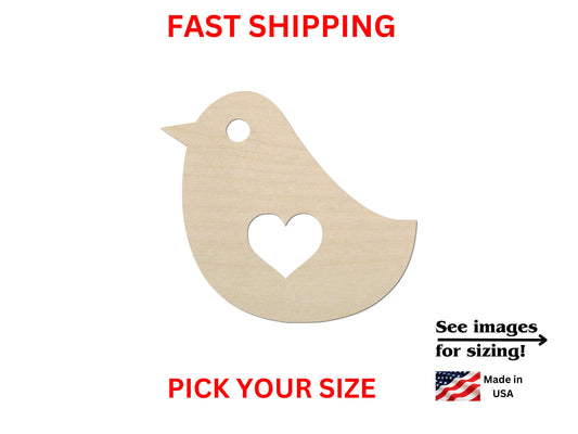 a wooden cutout of a bird with a heart