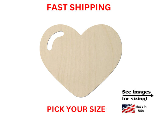 a wooden heart with a measuring line in front of it