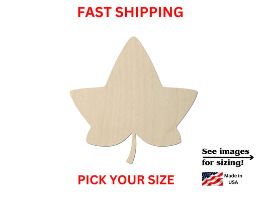 a wooden cutout of a leaf on a white background